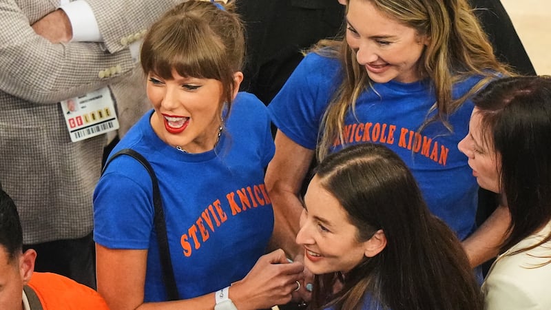 Taylor Swift, with Este Haim, center right back, and Alana Haim, center right front, arrives...