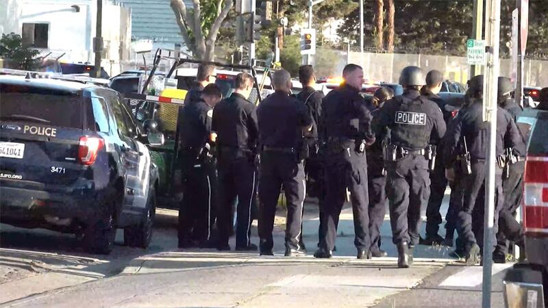 Officers respond to a shooting at a San Jose light rail railyard on Wednesday. Multiple deaths...