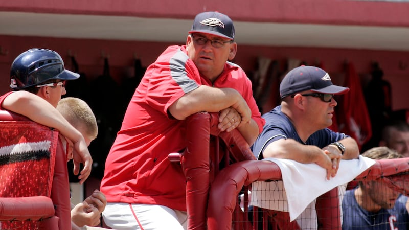 Liberty's coach Jim Toman looks out from the dugout during an NCAA regional tournament...