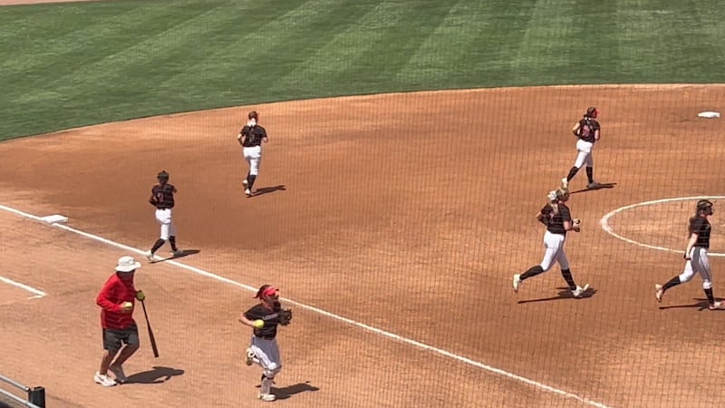 The Lakeshore High School softball team takes the field for its state semifinal matchup on...