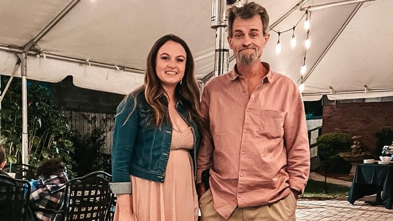 Brian Oliver is shown with one of his daughters.