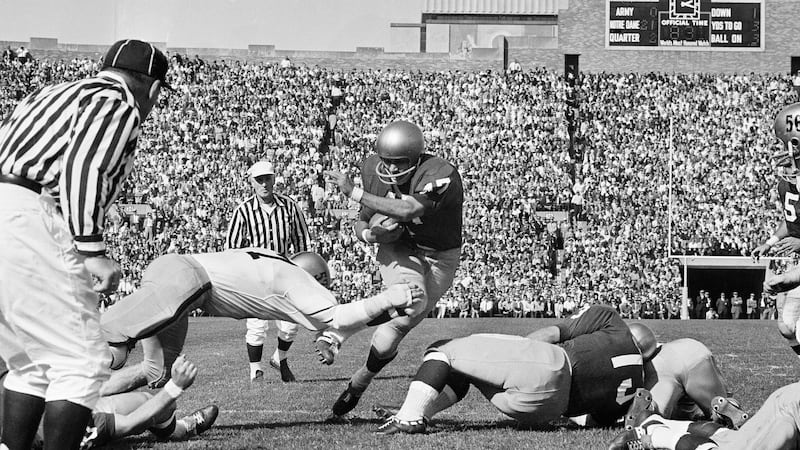 Notre Dame halfback Nick Eddy (47), slants through the Army line en route to a touchdown, Oct....