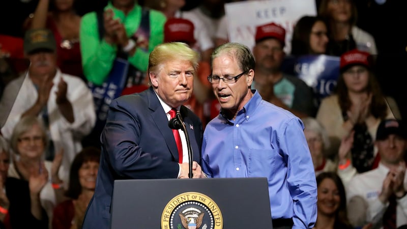 FILE - In this May 10, 2018 file photo, President Donald Trump, left, and Indiana Republican...