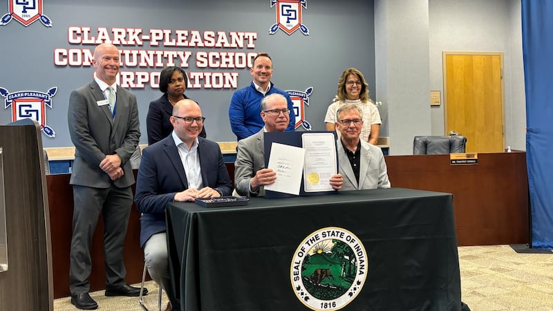 Indiana Gov. Mike Braun ceremonially signed a bill banning cellphones for Hoosier students for...