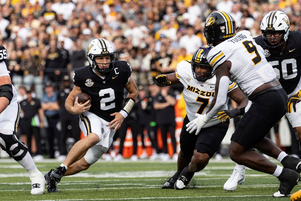 Vanderbilt quarterback Diego Pavia (2) runs for yardage during the first half of an NCAA...