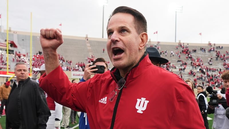 FILE - Indiana head coach Curt Cignetti shouts to the fans as he leaves the field following an...