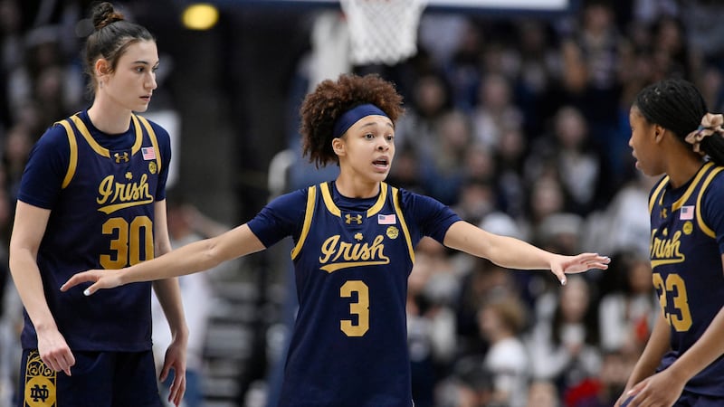 Notre Dame guard Hannah Hidalgo (3) talks with Notre Dame forward Gisela Sanchez (30) and...
