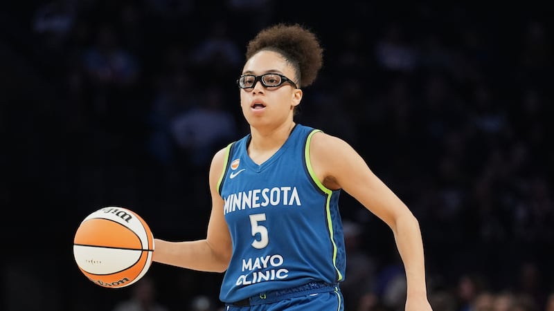 Minnesota Lynx guard Olivia Miles (5) dribbles down the court during the first half of a WNBA...