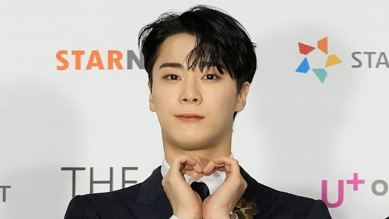 FILE - Moon Bin, a member of K-Pop group ASTRO, poses for photos on the red carpet for the...