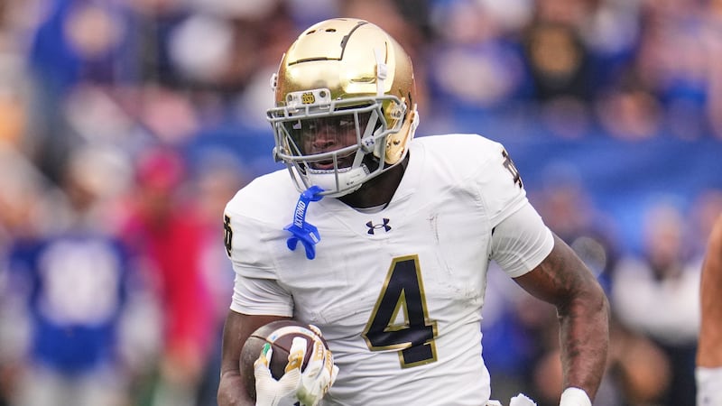 Notre Dame running back Jeremiyah Love (4) carries the ball during the first half of an NCAA...