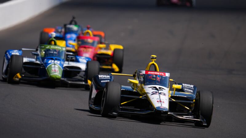 Colton Herta drives into the first turn during practice for the Indianapolis 500 auto race at...