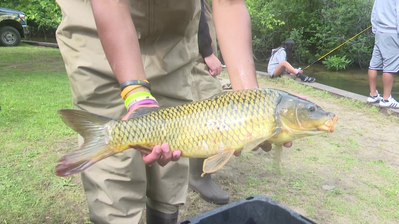 Kids in attendance visited five stations to learn the basics of fishing, such as safely...