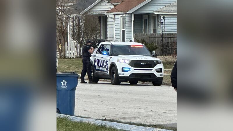 Officers surround an apartment in the 300 block of W. Battell Street in Mishawaka after a...