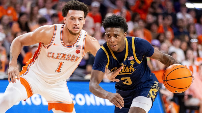 Notre Dame guard Markus Burton (3) drives past Clemson guard Chase Hunter (1) during the first...