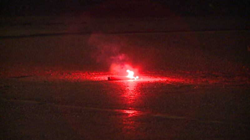 A road flare sitting in the middle of a Toledo street has raised questions for some residents.