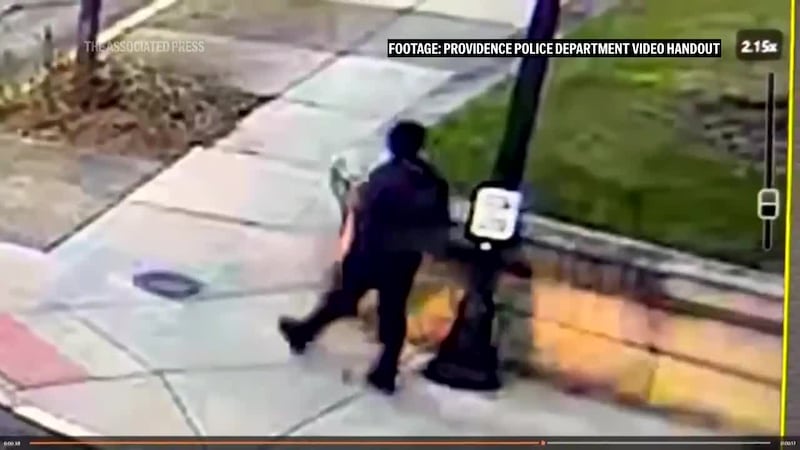 Surveillance video released by police shows the suspect, dressed in black, calmly walking away...
