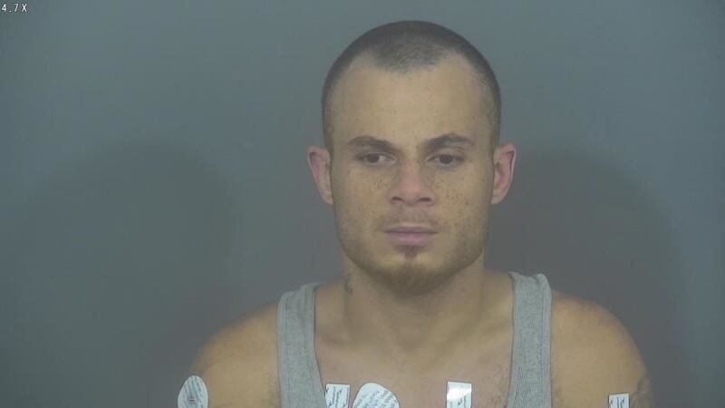 A suspect in the robbery of a South Bend pizza shop was held down by employees just outside...